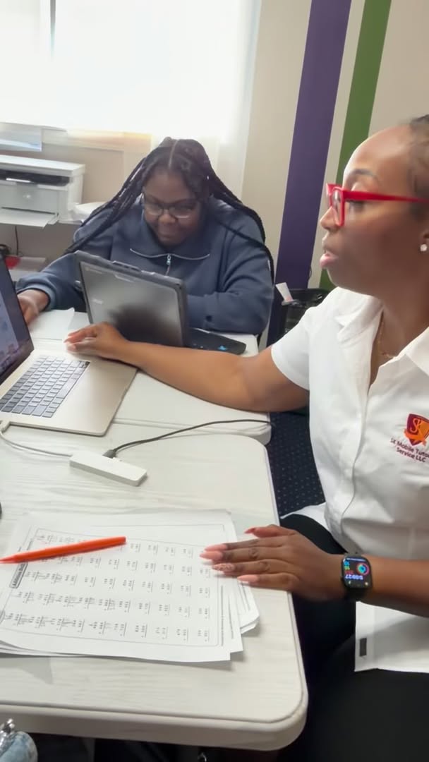 Katrina working with a student